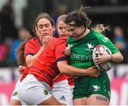 21 January 2023; Shannon Touhey of Connacht tries to break away from Munster players Alana McInerney and Nicole Cronin during the Vodafone Women’s Interprovincial Championship Round Three match between Connacht and Munster at The Sportsground in Galway. Photo by Ray Ryan/Sportsfile