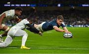 21 January 2023; Garry Ringrose of Leinster scores his side's sixth try despite the tackles of Christian Wade and Kitione Kamikamica of Racing 92 during the Heineken Champions Cup Pool A Round 4 match between Leinster and Racing 92 at Aviva Stadium in Dublin. Photo by Brendan Moran/Sportsfile