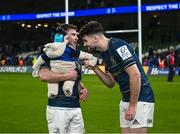 21 January 2023; Luke McGrath of Leinster with his son Bobby, aged seven months, and Harry Byrne of Leinster after their side's victory in the Heineken Champions Cup Pool A Round 4 match between Leinster and Racing 92 at Aviva Stadium in Dublin. Photo by Harry Murphy/Sportsfile