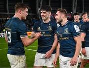 21 January 2023; Leinster players, from left, Garry Ringrose, Jimmy O'Brien and Jordan Larmour after their side's victory in the Heineken Champions Cup Pool A Round 4 match between Leinster and Racing 92 at Aviva Stadium in Dublin. Photo by Harry Murphy/Sportsfile