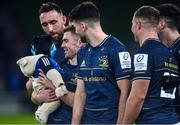21 January 2023; Luke McGrath of Leinster with his son Bobby, age 7 months and team mates, from left, Jack Conan, Harry Byrne and Scott Penny after the Heineken Champions Cup Pool A Round 4 match between Leinster and Racing 92 at Aviva Stadium in Dublin. Photo by David Fitzgerald/Sportsfile