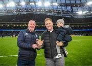 21 January 2023; James Tracy, with his son Bay, is presented a trophy by Dave Ryan of the OLSC during the Heineken Champions Cup Pool A Round 4 match between Leinster and Racing 92 at Aviva Stadium in Dublin. Photo by Harry Murphy/Sportsfile