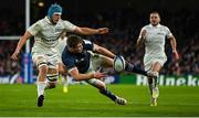 21 January 2023; Garry Ringrose of Leinster passes to team-mate Jimmy O'Brien, not pictured, despite the attention of Maxime Baudonne of Racing 92, during the Heineken Champions Cup Pool A Round 4 match between Leinster and Racing 92 at Aviva Stadium in Dublin. Photo by Brendan Moran/Sportsfile