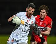 21 January 2023; Matthew Donnelly of Tyrone in action against Eoghan McAvoy of Derry during the Bank of Ireland Dr McKenna Cup Final match between Derry and Tyrone at Athletic Grounds in Armagh. Photo by Oliver McVeigh/Sportsfile