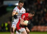 21 January 2023; Gareth McKinless of Derry in action against Brian Kennedy of Tyrone during the Bank of Ireland Dr McKenna Cup Final match between Derry and Tyrone at Athletic Grounds in Armagh. Photo by Oliver McVeigh/Sportsfile
