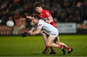 21 January 2023; Kieran McGeary of Tyrone in action against Eoghan McAvoy of Derry during the Bank of Ireland Dr McKenna Cup Final match between Derry and Tyrone at Athletic Grounds in Armagh. Photo by Oliver McVeigh/Sportsfile