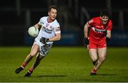 21 January 2023; Kieran McGeary of Tyrone in action against Padraig McGrogan of Derry during the Bank of Ireland Dr McKenna Cup Final match between Derry and Tyrone at Athletic Grounds in Armagh. Photo by Oliver McVeigh/Sportsfile