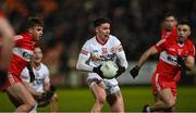 21 January 2023; Liam Nugent of Tyrone in action against Shane McGuigan and Niall Toner of Derry during the Bank of Ireland Dr McKenna Cup Final match between Derry and Tyrone at Athletic Grounds in Armagh. Photo by Oliver McVeigh/Sportsfile