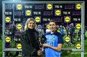 21 January 2023; Jess Tobin of Dublin is presented with the Player of the Match award by Fiona Fahey, Sales Operation Manager, Lidl Ireland, following the 2023 Lidl Ladies National Football League Division 1 Round 1 fixture between Dublin and Meath at DCU St Clare’s, Dublin.  Photo by Eóin Noonan/Sportsfile