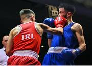 21 January 2023; Paul Loonam of St Carthages Boxing Club, Offaly, left, and Sean Purcell of Saviours Crystal Boxing Club, Waterford, during their featherweight 57kg final bout at the IABA National Elite Boxing Championships Finals at the National Boxing Stadium in Dublin. Photo by Seb Daly/Sportsfile