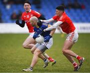 21 January 2023; Peter Foy of Longford is tackled by Jay Hughes of Louth during the O'Byrne Cup Final match between Longford and Louth at Glennon Brothers Pearse Park in Longford. Photo by Ray McManus/Sportsfile