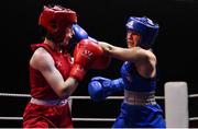 21 January 2023; Ciara Walsh of Smithfield Boxing Club, Dublin, right, and Nicole Buckley of St Carthages Boxing Club, Offaly, during their minimumweight 48kg final bout at the IABA National Elite Boxing Championships Finals at the National Boxing Stadium in Dublin. Photo by Seb Daly/Sportsfile