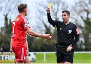 21 January 2023; Referee David Dunne shows a yellow card to Brian McManus of Shelbourne during the Pre-Season Friendly match between Shelbourne and Bohemians at AUL Complex in Clonshaugh, Dublin. Photo by Tyler Miller/Sportsfile