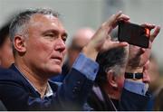 21 January 2023; FIBA Europe Executive Director Kamil Novak takes a video on his smartphone during the Basketball Ireland Pat Duffy National Cup Final match between DBS Éanna and University of Galway Maree at National Basketball Arena in Tallaght, Dublin. Photo by Ben McShane/Sportsfile