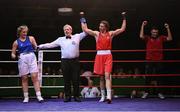 21 January 2023; Aoife O’Rourke of Olympic Boxing Club, Galway, second from right, celebrates victory over Aoibhe Carabine of Geesala Boxing Club, Mayo, during their middleweight 75kg final bout at the IABA National Elite Boxing Championships Finals at the National Boxing Stadium in Dublin. Photo by Seb Daly/Sportsfile