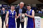 21 January 2023; University of Galway Maree co-captains Stephen Commins, left, and Eoin Rockall are presented the Pat Duffy National Cup by FIBA Europe Executive Director Kamil Novak after the Basketball Ireland Pat Duffy National Cup Final match between DBS Éanna and University of Galway Maree at National Basketball Arena in Tallaght, Dublin. Photo by Ben McShane/Sportsfile