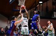 21 January 2023; Joshua Wilson of DBS Éanna in action against John Burke, left, and Jarett Haines of University of Galway Maree during the Basketball Ireland Pat Duffy National Cup Final match between DBS Éanna and University of Galway Maree at National Basketball Arena in Tallaght, Dublin. Photo by Ben McShane/Sportsfile