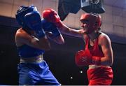 21 January 2023; Michaela Walsh of Emerald ABC, Belfast, right, and Kelsey Leonard of Unit 3 Boxing Club, Kildare, during their featherweight 57kg final bout at the IABA National Elite Boxing Championships Finals at the National Boxing Stadium in Dublin. Photo by Seb Daly/Sportsfile