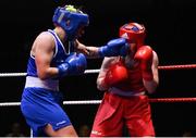21 January 2023; Grainne Walsh of Spartacus Boxing Club, Offaly, left, and Amy Broadhurst of St Bronagh's ABC, Louth, during their welterweight 66kg final bout at the IABA National Elite Boxing Championships Finals at the National Boxing Stadium in Dublin. Photo by Seb Daly/Sportsfile