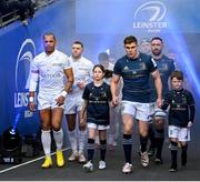 21 January 2023; Racing 92 captain Gael Fickou and Leinster captain Garry Ringrose, with match day mascots Lauren Campion and Jack Byrne, walk out before the Heineken Champions Cup Pool A Round 4 match between Leinster and Racing 92 at Aviva Stadium in Dublin. Photo by Harry Murphy/Sportsfile