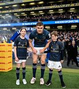 21 January 2023; Leinster captain Garry Ringrose with match day mascots Lauren Campion, aged 11, and Jack Byrne aged eight, before the Heineken Champions Cup Pool A Round 4 match between Leinster and Racing 92 at Aviva Stadium in Dublin. Photo by Harry Murphy/Sportsfile