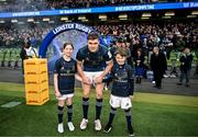 21 January 2023; Leinster captain Garry Ringrose with match day mascots Lauren Campion, aged 11, and Jack Byrne aged eight, before the Heineken Champions Cup Pool A Round 4 match between Leinster and Racing 92 at Aviva Stadium in Dublin. Photo by Harry Murphy/Sportsfile