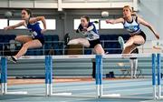 22 January 2023; Caoimhe Fitzsimons of Ratoath, Meath, right, competing in the Women's 60m Hurdles during day two of the 123.ie National Indoor League Round 2 & Combined Events at TUS Athlone in Westmeath. Photo by Harry Murphy/Sportsfile