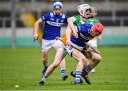 22 January 2023; James Duggan of Laois in action against Conor Hardiman of Offaly during the Walsh Cup Group 2 Round 3 match between Offaly and Laois at Glenisk O'Connor Park in Tullamore, Offaly. Photo by Tyler Miller/Sportsfile