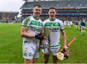 22 January 2023; TJ Reid and his brother Richie Reid of Shamrocks Ballyhale celebrate with the Tommy Moore cup after the AIB GAA Hurling All-Ireland Senior Club Championship Final match between Shamrocks Ballyhale of Kilkenny and Dunloy Cuchullains of Antrim at Croke Park in Dublin. Photo by Daire Brennan/Sportsfile