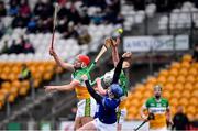 22 January 2023; Padraug Lalor of Laois battles for possession against Padraig Cantwell, left, and Joey Keenaghan of Offaly during the Walsh Cup Group 2 Round 3 match between Offaly and Laois at Glenisk O'Connor Park in Tullamore, Offaly. Photo by Tyler Miller/Sportsfile