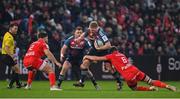 22 January 2023; John Ryan of Munster is tackled by Julien Marchand and Anthony Jelonch of Toulouse during the Heineken Champions Cup Pool B Round 4 match between Toulouse and Munster at Stade Ernest Wallon in Toulouse, France. Photo by Brendan Moran/Sportsfile