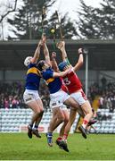 22 January 2023; Cork players Colin Walsh and Robbie O’Flynn and Tipperary players Michael Breen and Gavin Ryan of Tipperary challenge for the sliotar during the Co-Op Superstores Munster Hurling League Final match between Cork and Tipperary at Páirc Ui Rinn in Cork. Photo by Seb Daly/Sportsfile