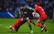 22 January 2023; Antoine Frisch of Munster is tackled by Dimitri Delibes, left, and Juan Cruz Mallia of Toulouse during the Heineken Champions Cup Pool B Round 4 match between Toulouse and Munster at Stade Ernest Wallon in Toulouse, France. Photo by Brendan Moran/Sportsfile