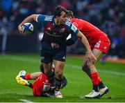 22 January 2023; Antoine Frisch of Munster is tackled by Dimitri Delibes, left, and Juan Cruz Mallia of Toulouse during the Heineken Champions Cup Pool B Round 4 match between Toulouse and Munster at Stade Ernest Wallon in Toulouse, France. Photo by Brendan Moran/Sportsfile