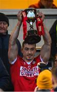 22 January 2023; Sean O'Donoghue of Cork lifts the trophy after his side's victory in the Co-Op Superstores Munster Hurling League Final match between Cork and Tipperary at Páirc Ui Rinn in Cork. Photo by Seb Daly/Sportsfile