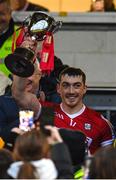 22 January 2023; Sean O'Donoghue of Cork lifts the trophy after his side's victory in the Co-Op Superstores Munster Hurling League Final match between Cork and Tipperary at Páirc Ui Rinn in Cork. Photo by Seb Daly/Sportsfile