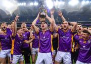 22 January 2023; Theo Clancy of Kilmacud Crokes celebrates with the Andy Merrigan Cup and team-mates after the AIB GAA Football All-Ireland Senior Club Championship Final match between Watty Graham's Glen of Derry and Kilmacud Crokes of Dublin at Croke Park in Dublin. Photo by Piaras Ó Mídheach/Sportsfile