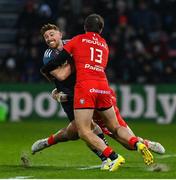 22 January 2023; Ben Healy of Munster in action against David Ainu'u, left, and Pierre-Louis Barassi of Toulouse during the Heineken Champions Cup Pool B Round 4 match between Toulouse and Munster at Stade Ernest Wallon in Toulouse, France. Photo by Brendan Moran/Sportsfile