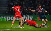 22 January 2023; Ben Healy of Munster is tackled by David Ainu'u, left, and Pierre-Louis Barassi of Toulouse, a tackle for which Healy was shown a yellow card for a raised arm,  during the Heineken Champions Cup Pool B Round 4 match between Toulouse and Munster at Stade Ernest Wallon in Toulouse, France. Photo by Brendan Moran/Sportsfile