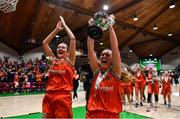 22 January 2023; Michelle Clarke, right, and Jenna Howe of Killester celebrate with the cup after the Basketball Ireland Paudie O'Connor National Cup Final match between Trinity Meteors and Killester at National Basketball Arena in Tallaght, Dublin. Photo by Ben McShane/Sportsfile