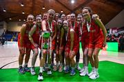 22 January 2023; Killester players celebrate with the cup after the Basketball Ireland Paudie O'Connor National Cup Final match between Trinity Meteors and Killester at National Basketball Arena in Tallaght, Dublin. Photo by Ben McShane/Sportsfile
