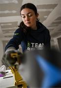 24 January 2023; Team Ireland alpine skier Eábha McKenna preparing her skis before the 2023 Winter European Youth Olympic Festival at Friuli-Venezia Giulia in Udine, Italy. Photo by Eóin Noonan/Sportsfile