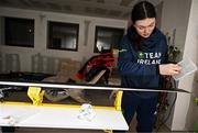 24 January 2023; Team Ireland alpine skier Eábha McKenna preparing her skis before the 2023 Winter European Youth Olympic Festival at Friuli-Venezia Giulia in Udine, Italy. Photo by Eóin Noonan/Sportsfile