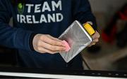 24 January 2023; Team Ireland alpine skier Eábha McKenna preparing her skis before the 2023 Winter European Youth Olympic Festival at Friuli-Venezia Giulia in Udine, Italy. Photo by Eóin Noonan/Sportsfile