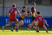 24 January 2023; Sean Byrne of CUS in action against Charlie O'Byrne, left, and Charlie O'Byrne of CUS during the Bank of Ireland Vinnie Murray Cup Semi-Final match between St Fintans High School and CUS at Energia Park in Dublin. Photo by Tyler Miller/Sportsfile