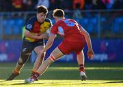 24 January 2023; Cian MacariKelly of St Fintans High School in action against Oliver Manks of CUS during the Bank of Ireland Vinnie Murray Cup Semi-Final match between St Fintans High School and CUS at Energia Park in Dublin. Photo by Tyler Miller/Sportsfile