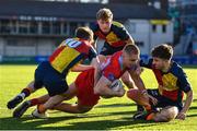 24 January 2023; Rian Tracey of CUS is tackled by Cillian Cleary of St Fintans High School, left, during the Bank of Ireland Vinnie Murray Cup Semi-Final match between St Fintans High School and CUS at Energia Park in Dublin. Photo by Tyler Miller/Sportsfile