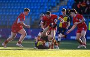 24 January 2023; Donagh Walsh of St Fintans High School is tackled by Aidan Walsh of CUS during the Bank of Ireland Vinnie Murray Cup Semi-Final match between St Fintans High School and CUS at Energia Park in Dublin. Photo by Tyler Miller/Sportsfile