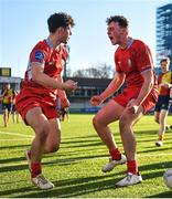 24 January 2023; Eoghan O'Reilly, left, celebrates with teammate Hugh Quigley of CUS after scoring his side a try during the Bank of Ireland Vinnie Murray Cup Semi-Final match between St Fintans High School and CUS at Energia Park in Dublin. Photo by Tyler Miller/Sportsfile