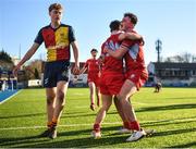 24 January 2023; Eoghan O'Reilly, left, celebrates with teammate Hugh Quigley of CUS after scoring his side a try during the Bank of Ireland Vinnie Murray Cup Semi-Final match between St Fintans High School and CUS at Energia Park in Dublin. Photo by Tyler Miller/Sportsfile